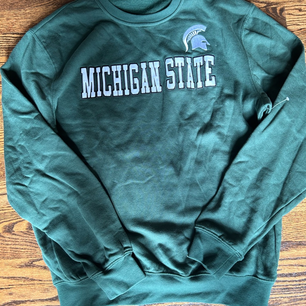 Michigan State sweatshirt with white fabric letters stitched on.  Spartan logo.